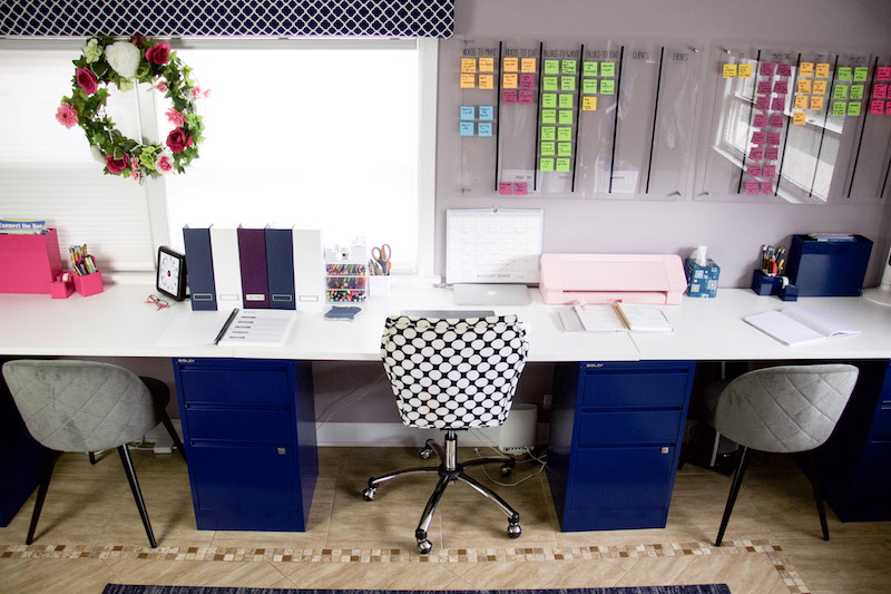 birdseye view of homeschool desk set up with 3 chairs and 3 desks
