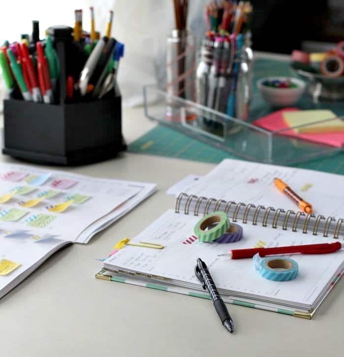 Open planner, pens, washi tape and other materials to get organized #planner