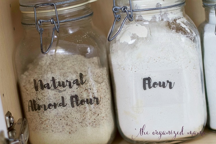 Learn how to quickly organize baking supplies from a professional organizer. She shares her favorite products plus gives you FREE hand lettered printable labels! #handlettered #organize #baking