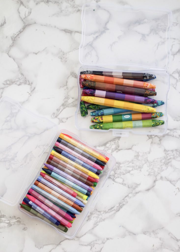 Crayons in clear containers. 
