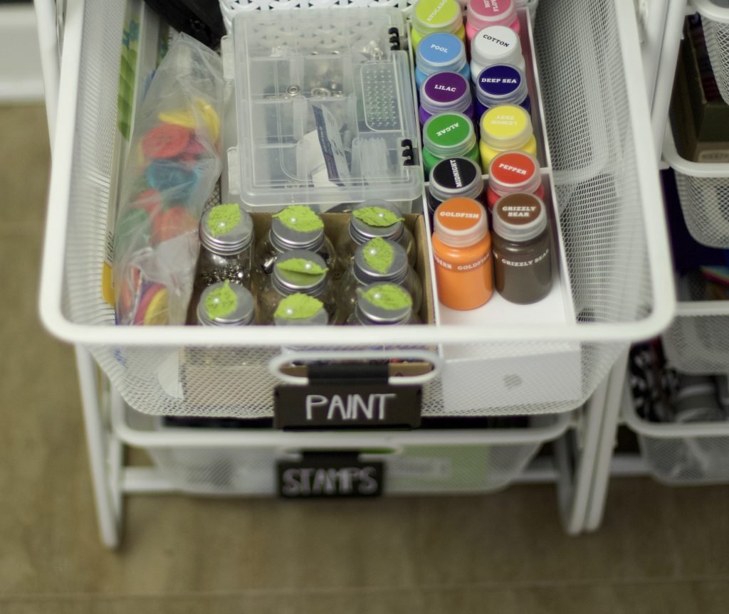 Paints and craft supplies organized in drawers. Use labels to keep drawers organized and everyone can find what they are looking for. #drawerorganization #professionalorganizer