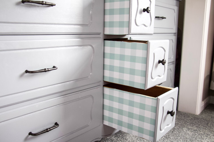 Three drawers pulled out with drawer liners on the outside of each drawer using Duck Brand shelf liner #organized