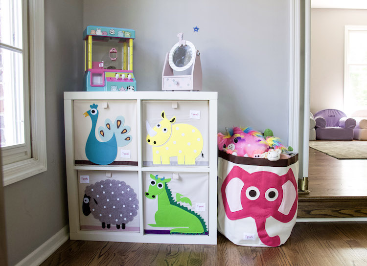 Playroom organization with 3 Sprouts bins in different animal prints in bright colored patterns to hold toys. #organized