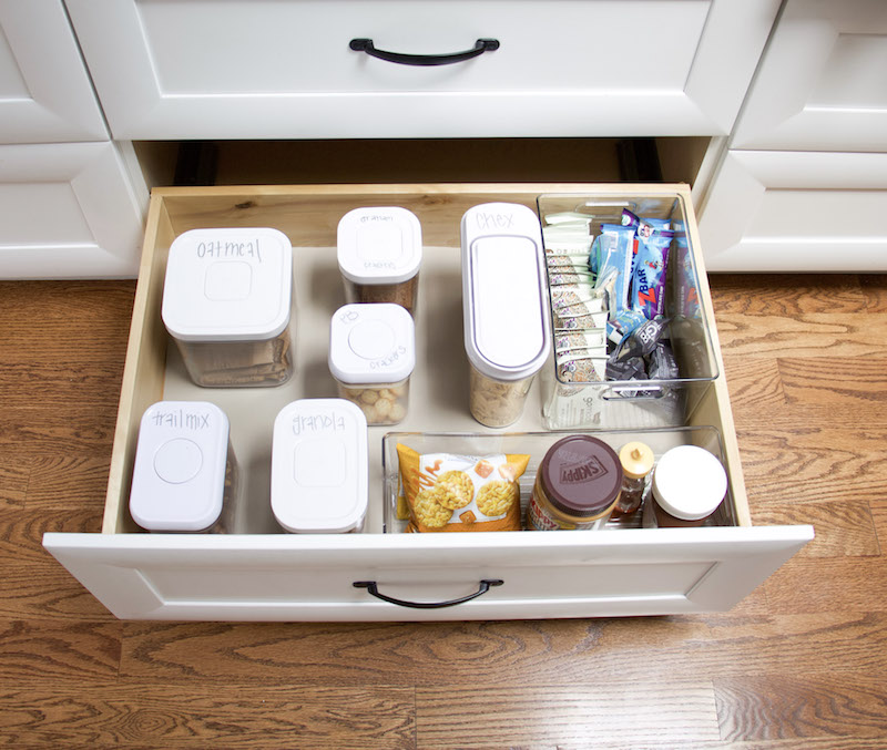 Kitchen pantry drawer open with containers and drawer organizers inside and bottom has easyliner on bottom to hold everything in place