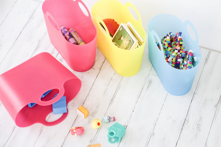 close up of four mini party totes from the container store storing baseball cards, pearler bead creations and mini shopkins
