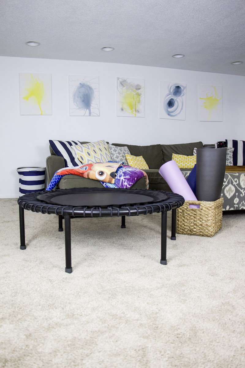 open basement with workout equipment near couch