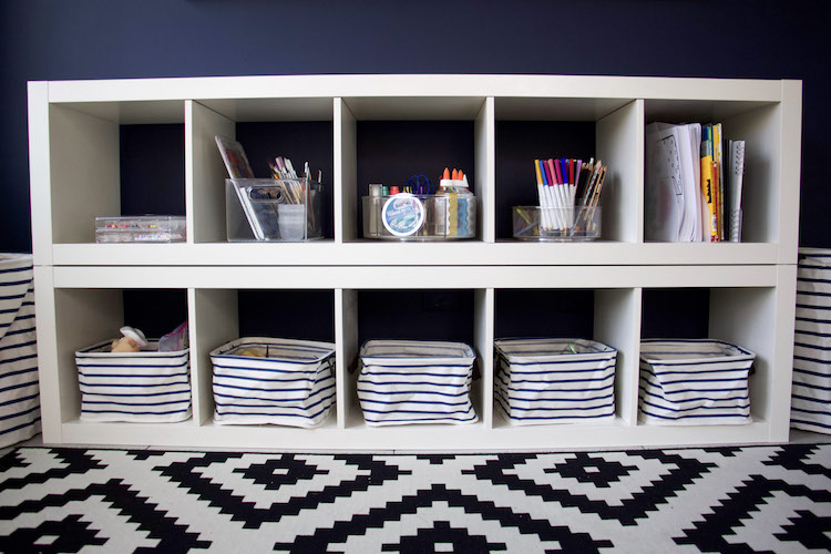 wide shot of toys in playroom organized and minimized so kids can find what they have easily