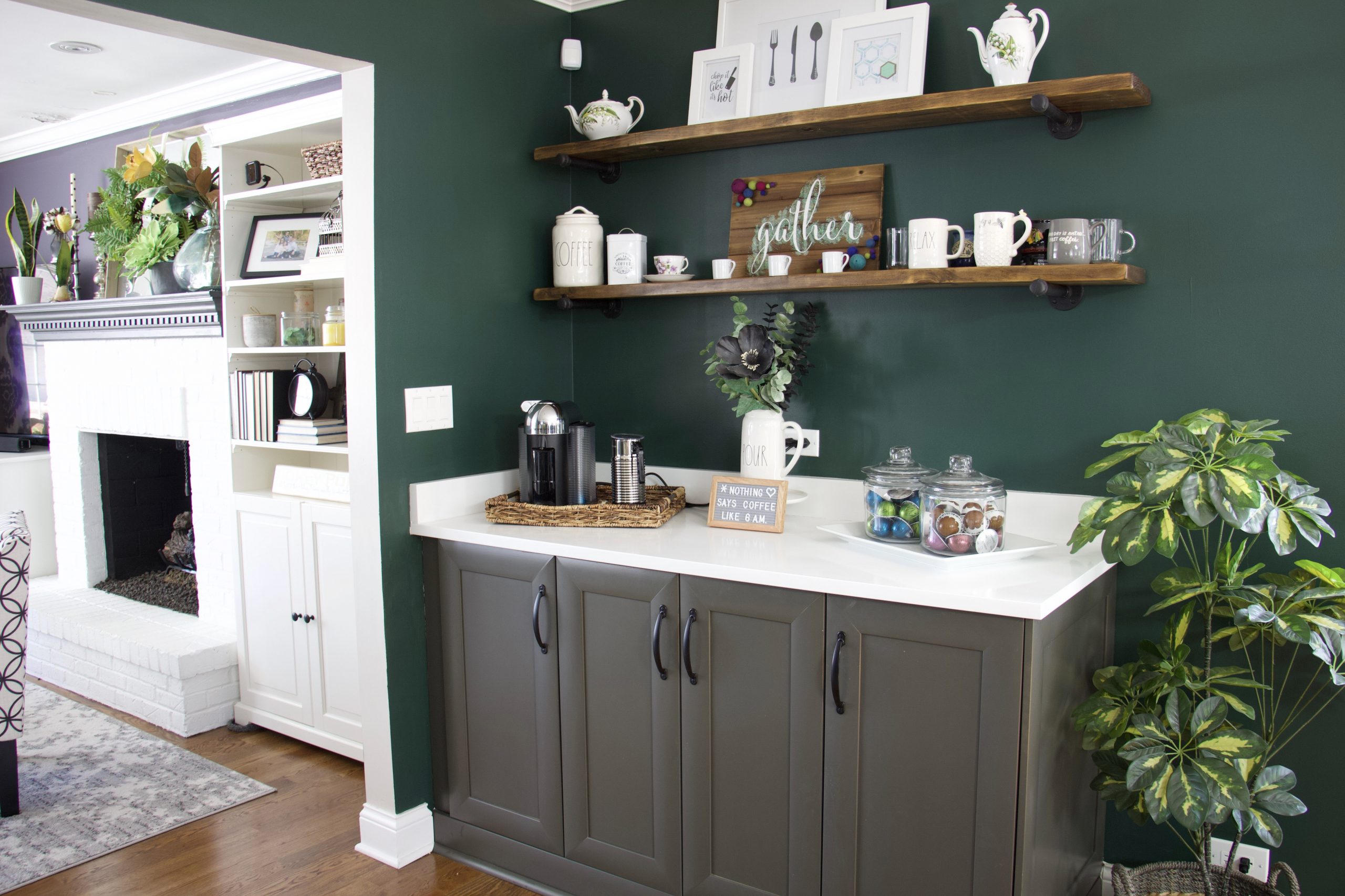 Organized dining room buffet and living room fireplace to represent an organized home. #organization