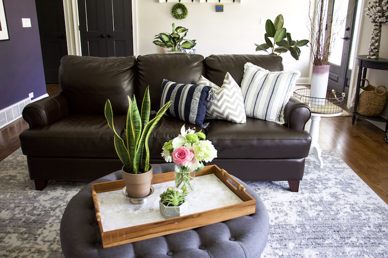 tray with EasyLiner and flowers in front of couch