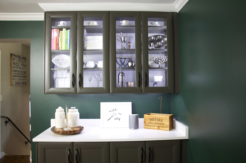 kitchen cabinets with items and backing of easyliner