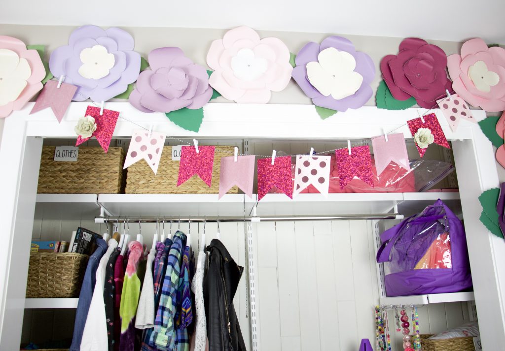 closet with paper flowers above
