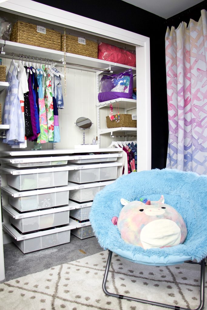 closet with chair and rug
