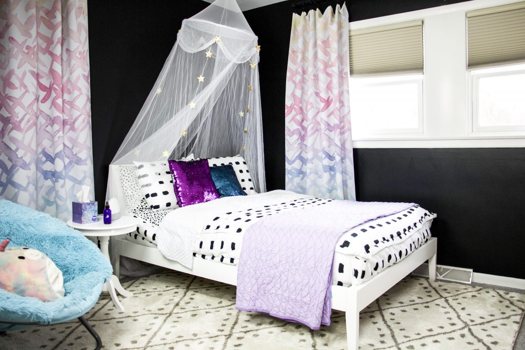 black satin paint with white bed in front of windows