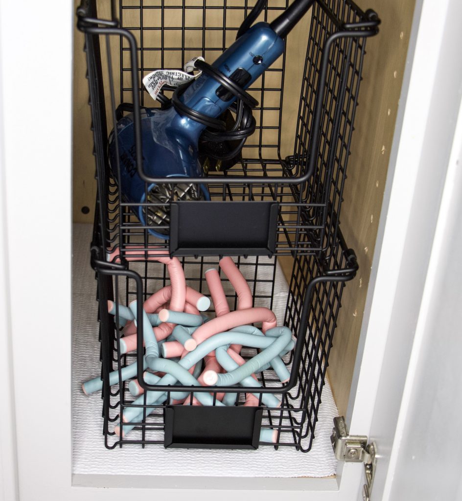stackable pantry bins with hair products to organize under bathroom sink