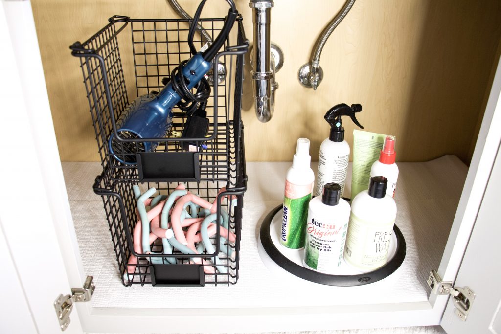 lining under bathroom sink with clorox easy liner