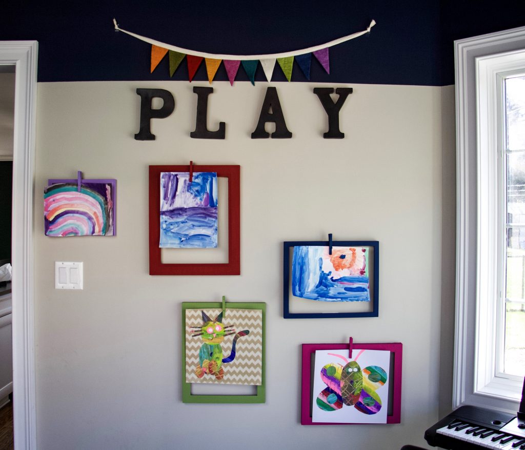 kids art display full room with all frames on wall