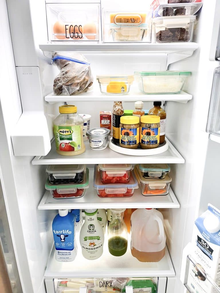 full fridge with shelf liner to keep things organized