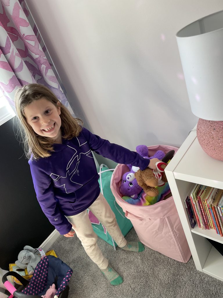 organizing stuffed animals with adleigh and her hamper full of stuffed animals