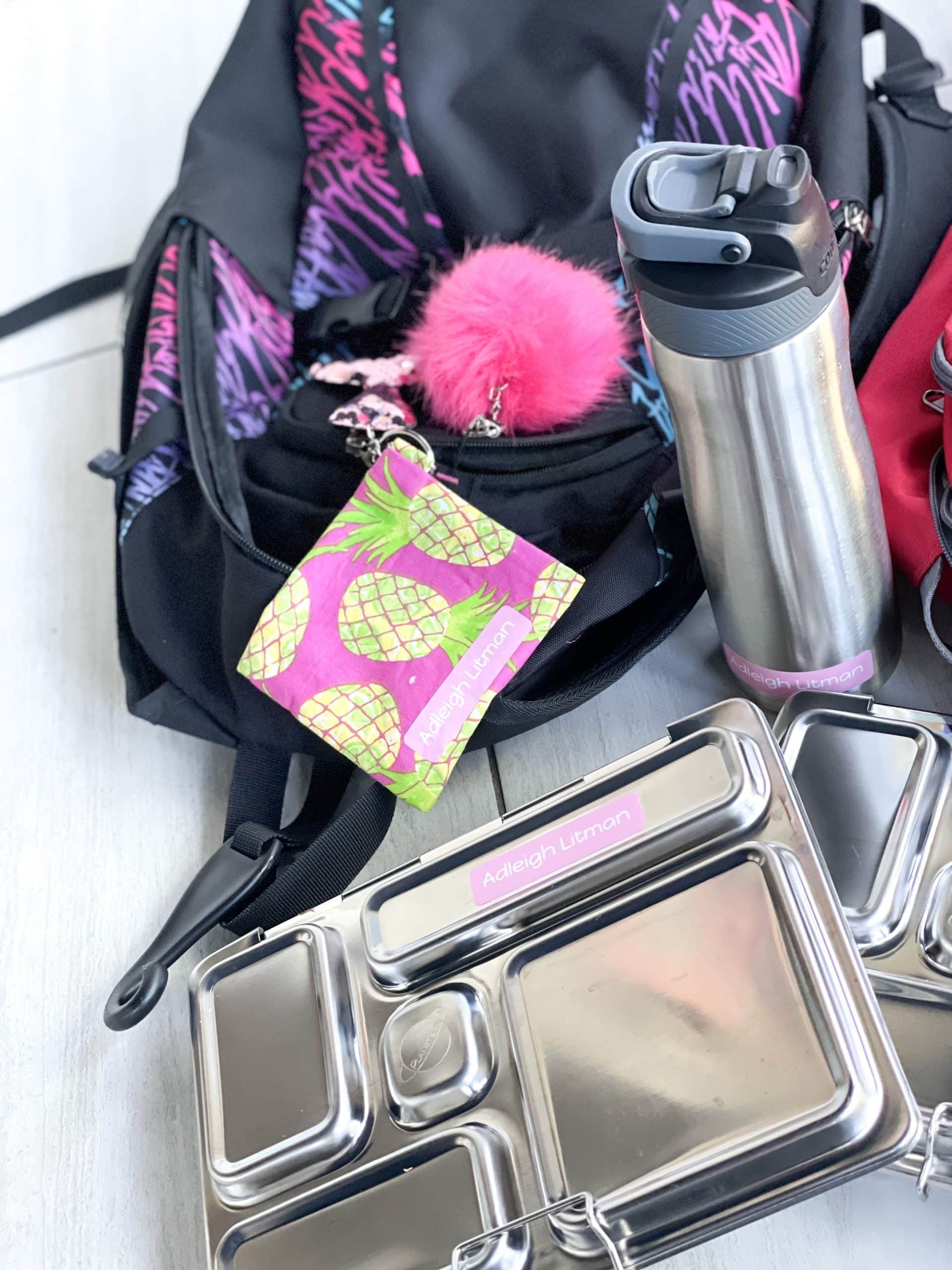 back in school with lunch box labeled and backpack