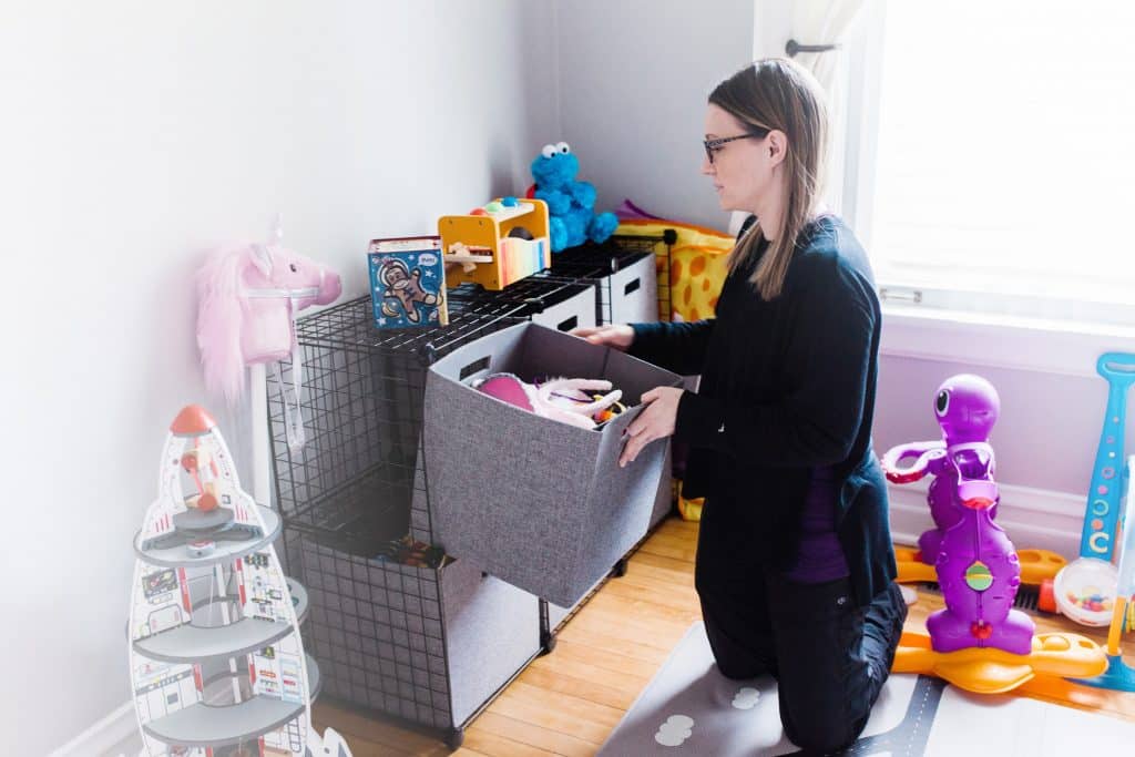 organized mama putting away toys