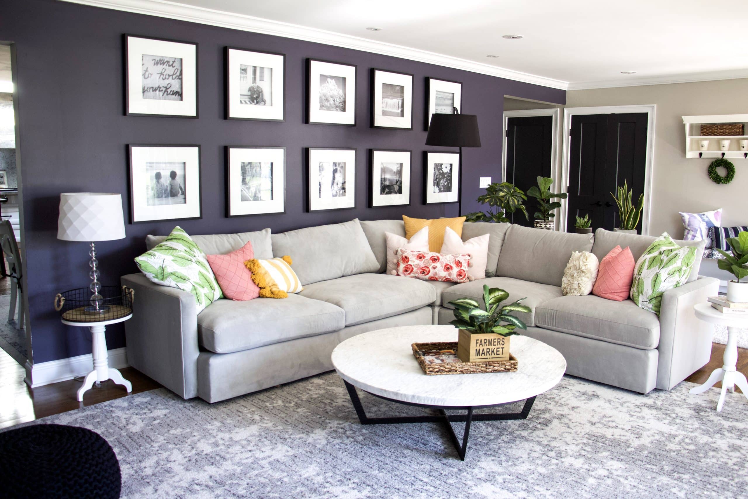 grey couch with cushions to demonstrate how to keep house clean