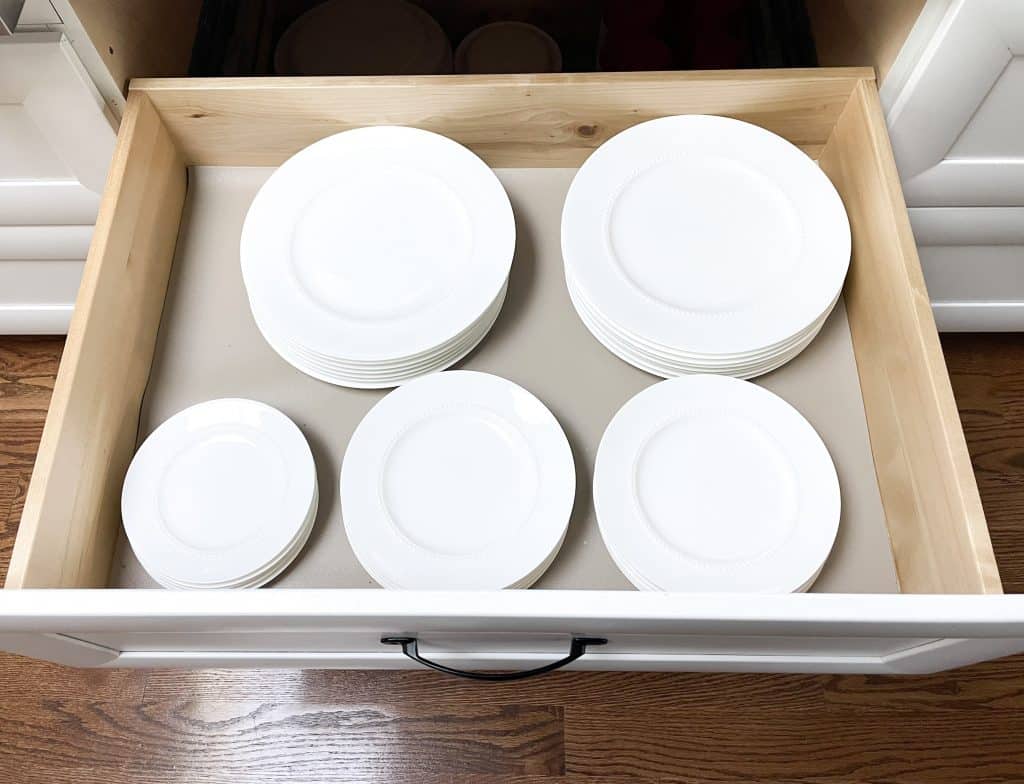 plates in drawer on drawer liner in kitchen