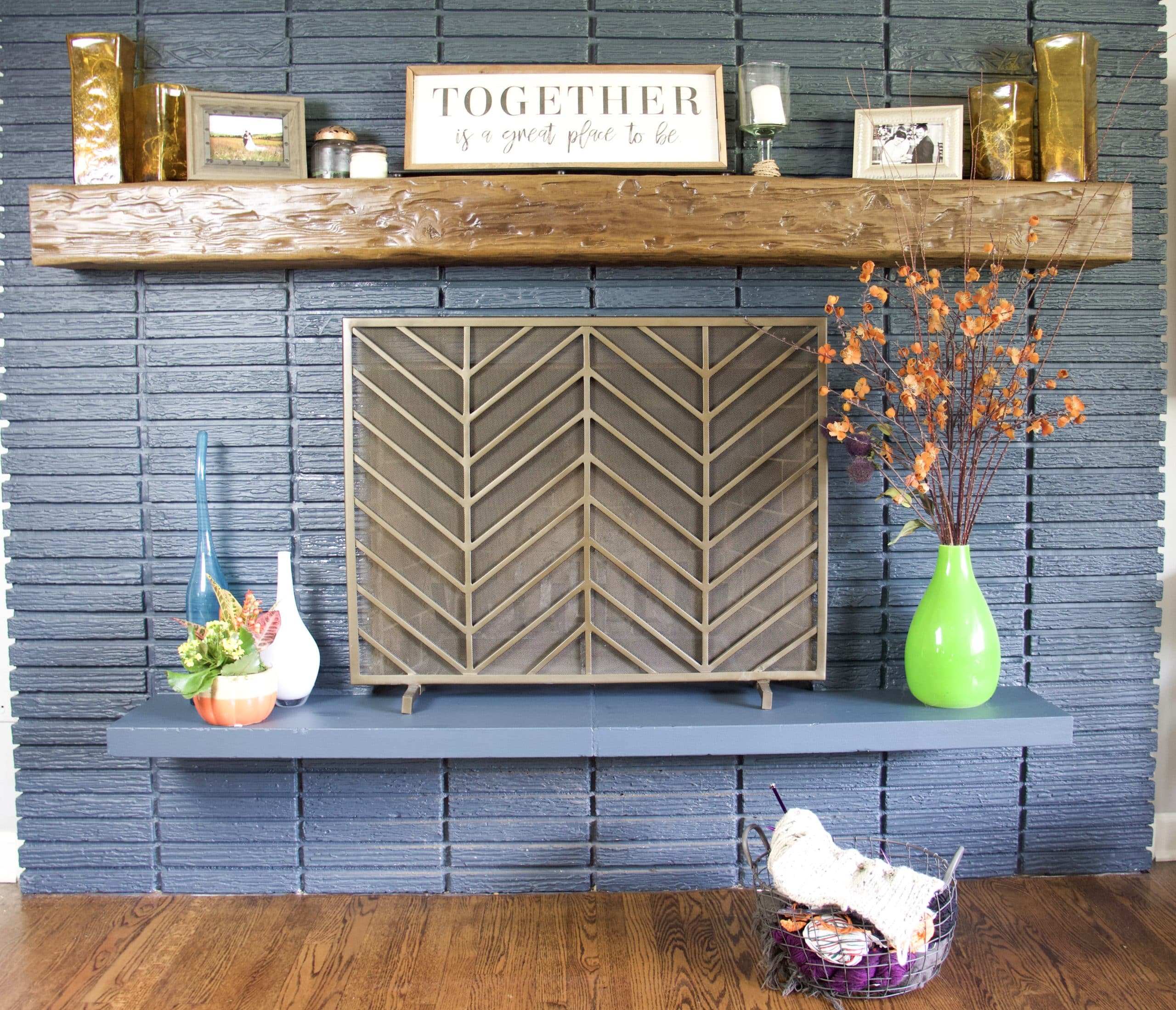 fall fireplace decor on navy blue brick fireplace