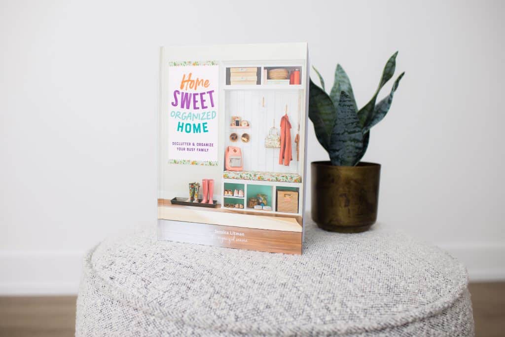 home sweet organized home on ottoman with plant