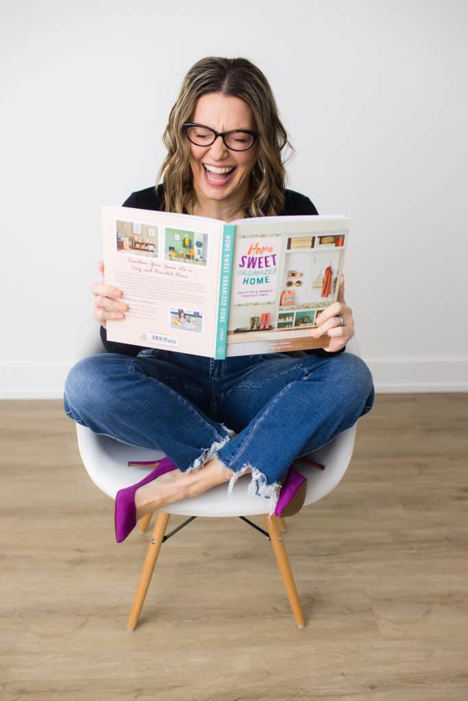 The Organized Mama reading Home Sweet Organized Home book
