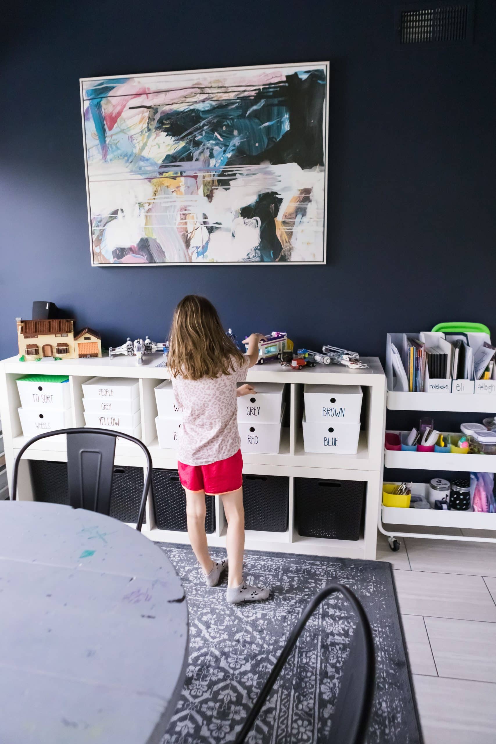 Organized Kids putting away toys