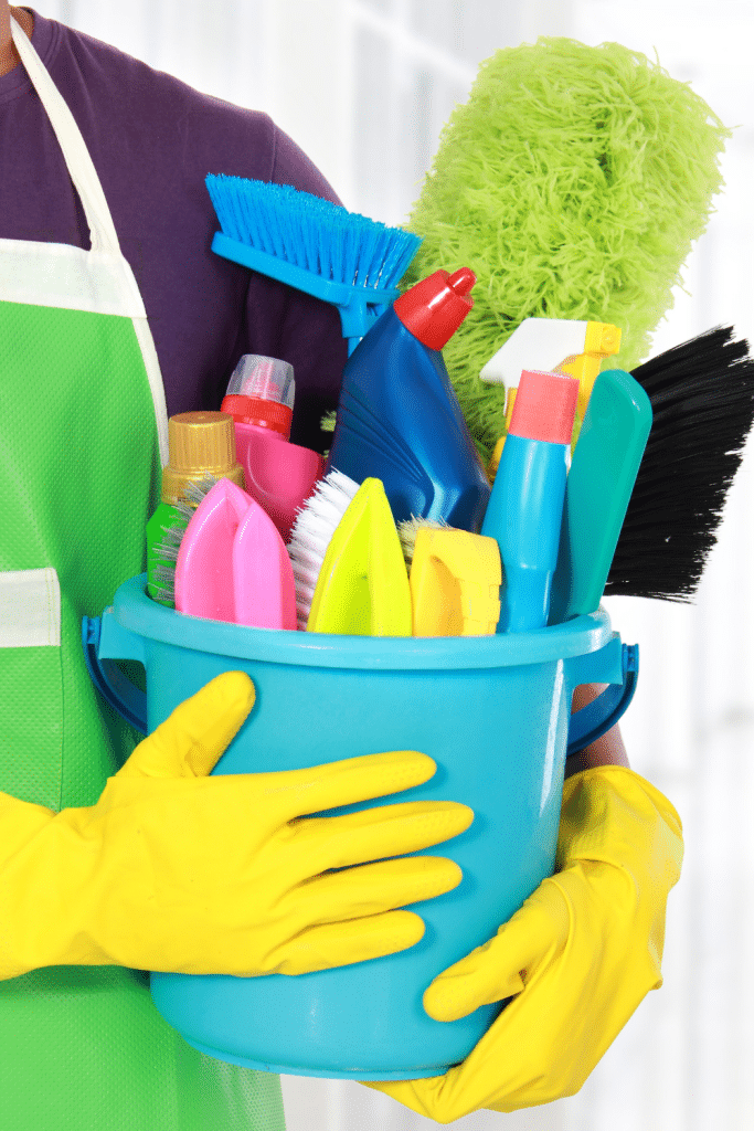 bucket of cleaning products for spring cleaning tips