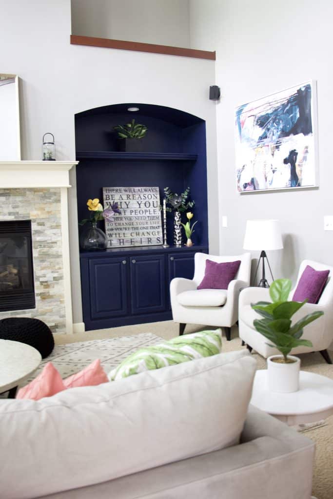 living room with navy blue shelving