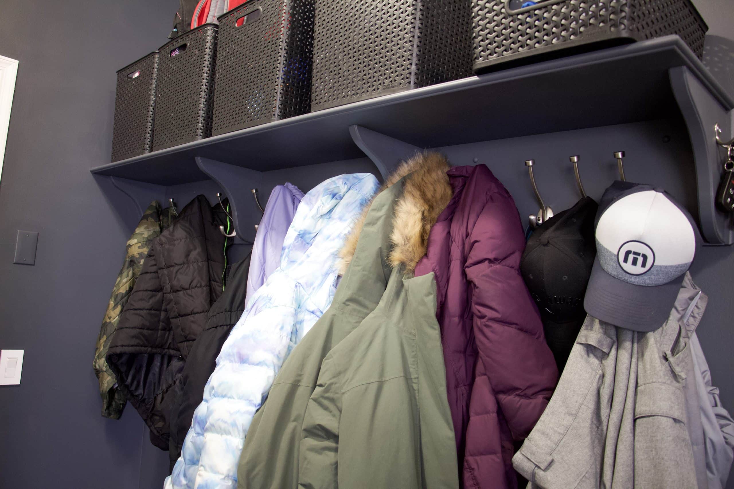 close up of mudroom hooks and bins